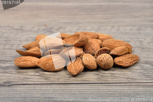 Image of Almonds on wood