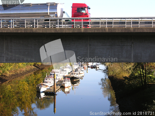 Image of Truck on a road above a boat canal in Oldenburg 