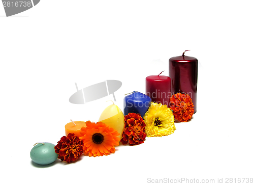 Image of Six candles arranged with flowers