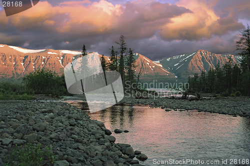 Image of Sunset over river and mountains