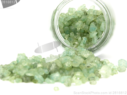 Image of Green granulate for bathing out of a glass