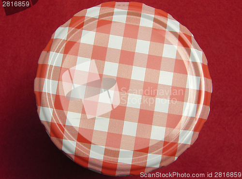 Image of Checked screw lid for glasses and a red background
