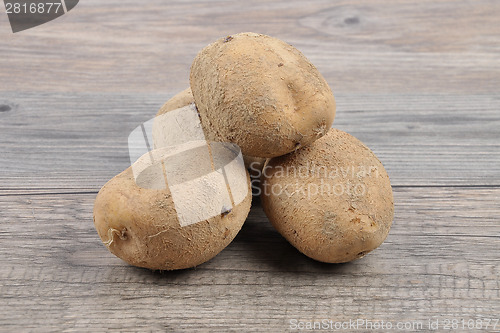 Image of Potatoes on wood