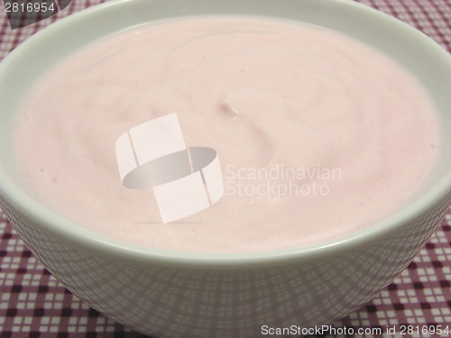 Image of Curd cheese in a bowl of chinaware on checked  tablecloth 