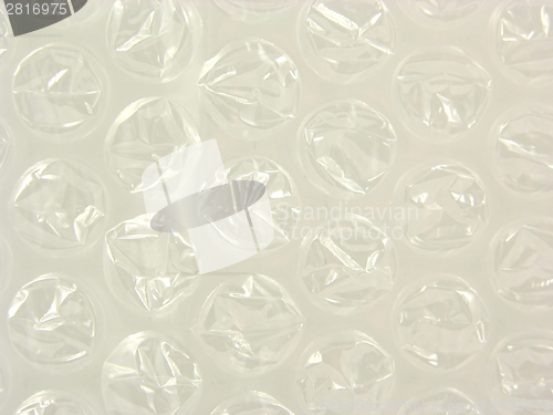 Image of Background with bursted bubbles of a plastic package foil