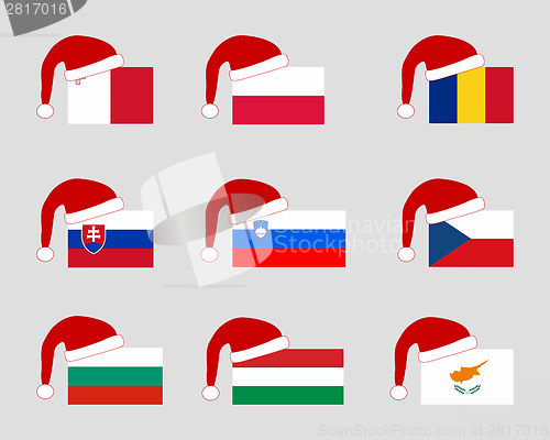 Image of Flag of nine countries with Santa Claus cap