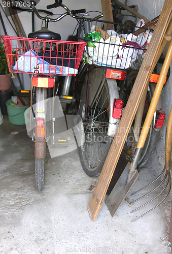 Image of Three bicycles in a basement of a house