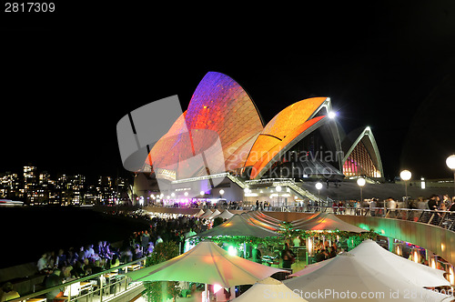 Image of Crowds of locals and tourists enjoy Sydney Opera House Vivid Syd