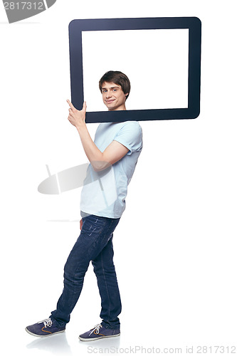 Image of Full length man carrying tablet frame