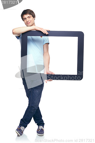 Image of Full length man holding tablet frame