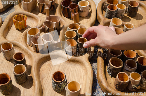 Image of hand take wooden hand carved stemware sold in fair 