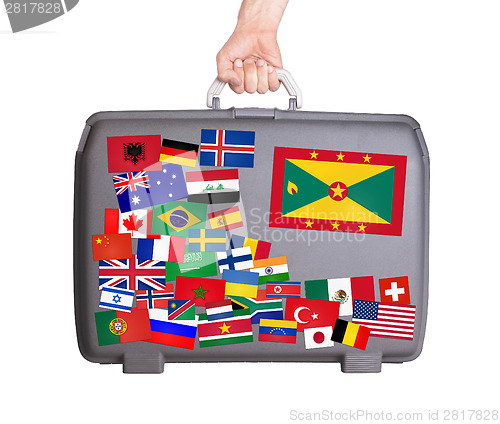 Image of Used plastic suitcase with stickers