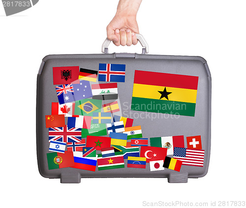 Image of Used plastic suitcase with stickers