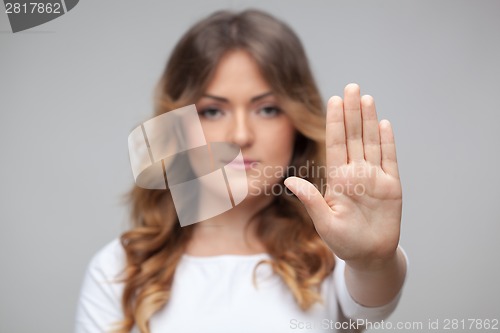 Image of female hand stop sign isolated on white