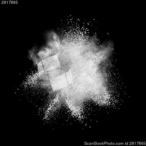 Image of White powder explosion isolated on black