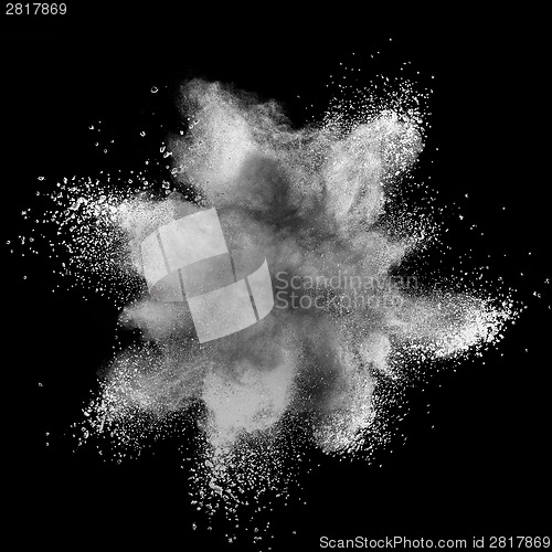 Image of White powder explosion isolated on black