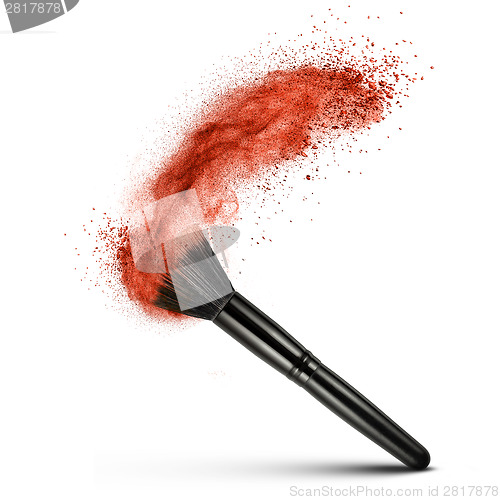 Image of makeup brush with red powder isolated