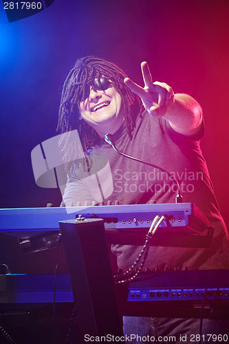 Image of Musician playing on a keyboard