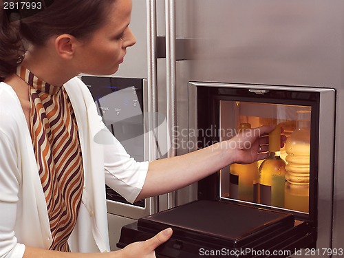 Image of woman looking for something to eat