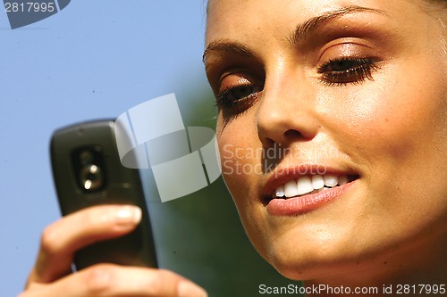 Image of woman talking on cell phone lll