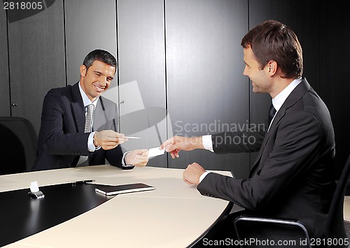 Image of people changing business cards