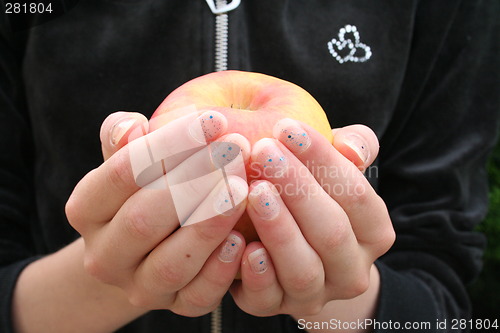 Image of Hands with apple