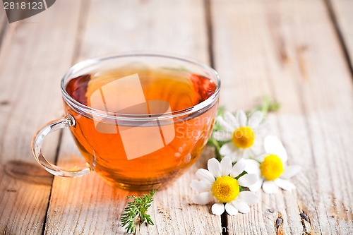 Image of cup of tea with chamomile flowers 