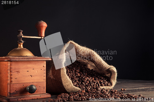 Image of old grinder and jute bag