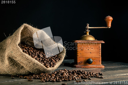 Image of sack of coffee beans and grnder