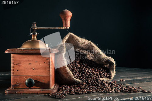 Image of old grinder and jute bag