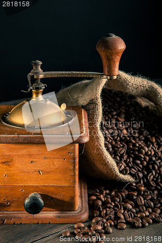 Image of old grinder and jute bag