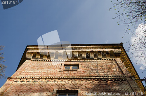 Image of manor fragment with windows on blue sky background 