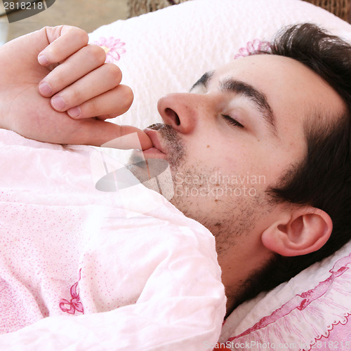 Image of Young man sleeping .