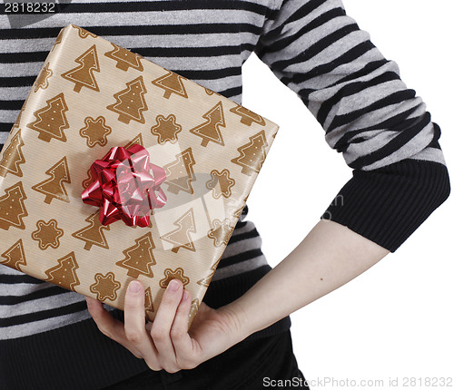 Image of Young woman holding a present