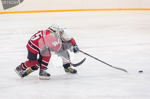 Image of Game of children ice-hockey teams