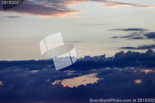 Image of Sky with dark clouds at sunset