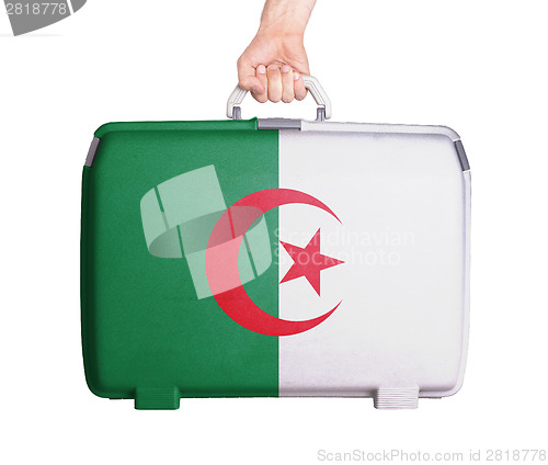 Image of Used plastic suitcase with stains and scratches