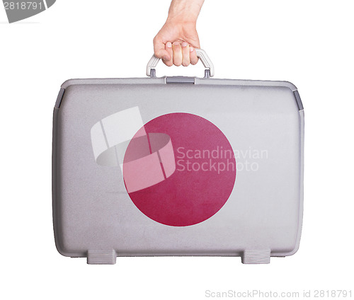 Image of Used plastic suitcase with stains and scratches