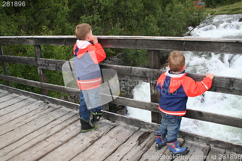 Image of Brothers looking at the waterfall