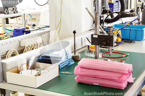 Image of electronics equipment assembly workplace