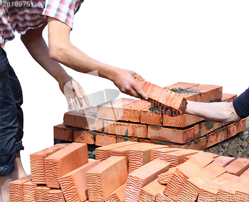 Image of Workers laid red bricks