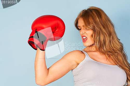 Image of Beautiful woman wearing boxing gloves