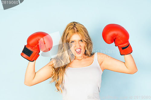 Image of Beautiful woman wearing boxing gloves