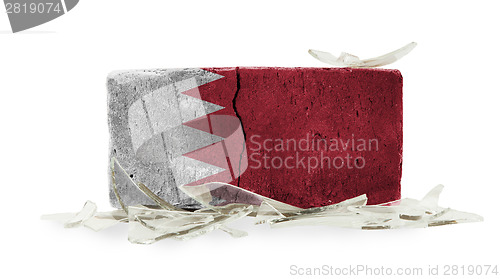 Image of Brick with broken glass, violence concept