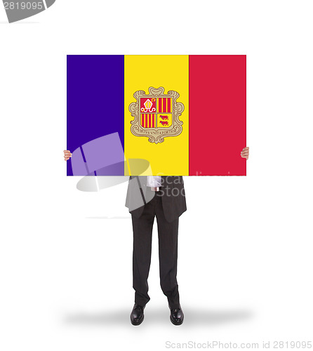 Image of Businessman holding a big card