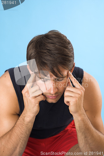 Image of young man having a headache