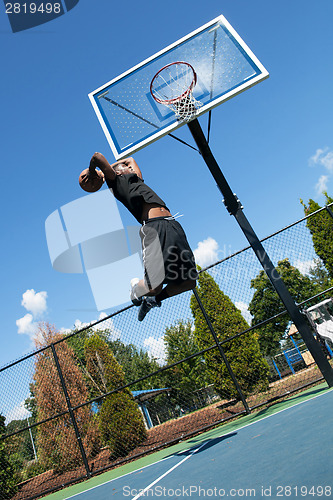 Image of Basketball Player Dunking