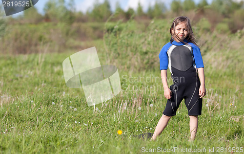 Image of Portrait of little girl in wetsuit