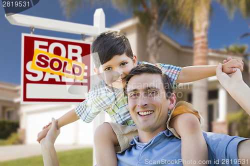 Image of Mixed Race Father, Son Piggyback, Front of House, Sold Sign