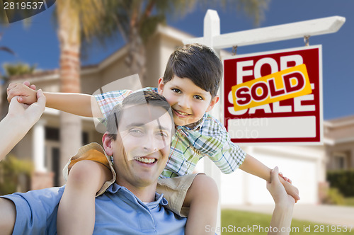 Image of Mixed Race Father, Son Piggyback, Front of House, Sold Sign